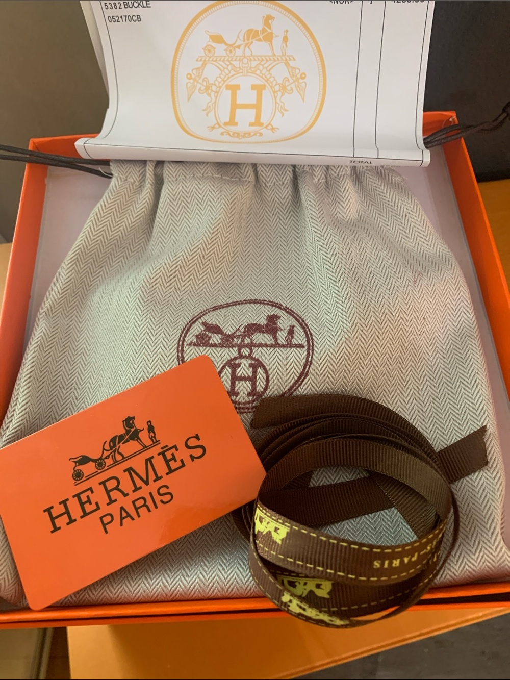 Hermes Brown and Orange Branded Ribbon Accessory box has light stains in corner